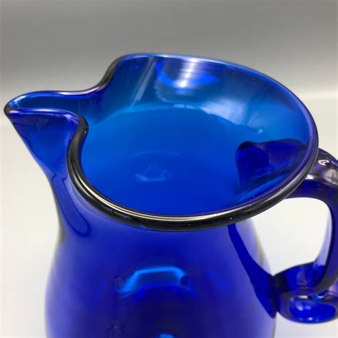 blue glass pitcher vintage|vintage cobalt blue pitcher.